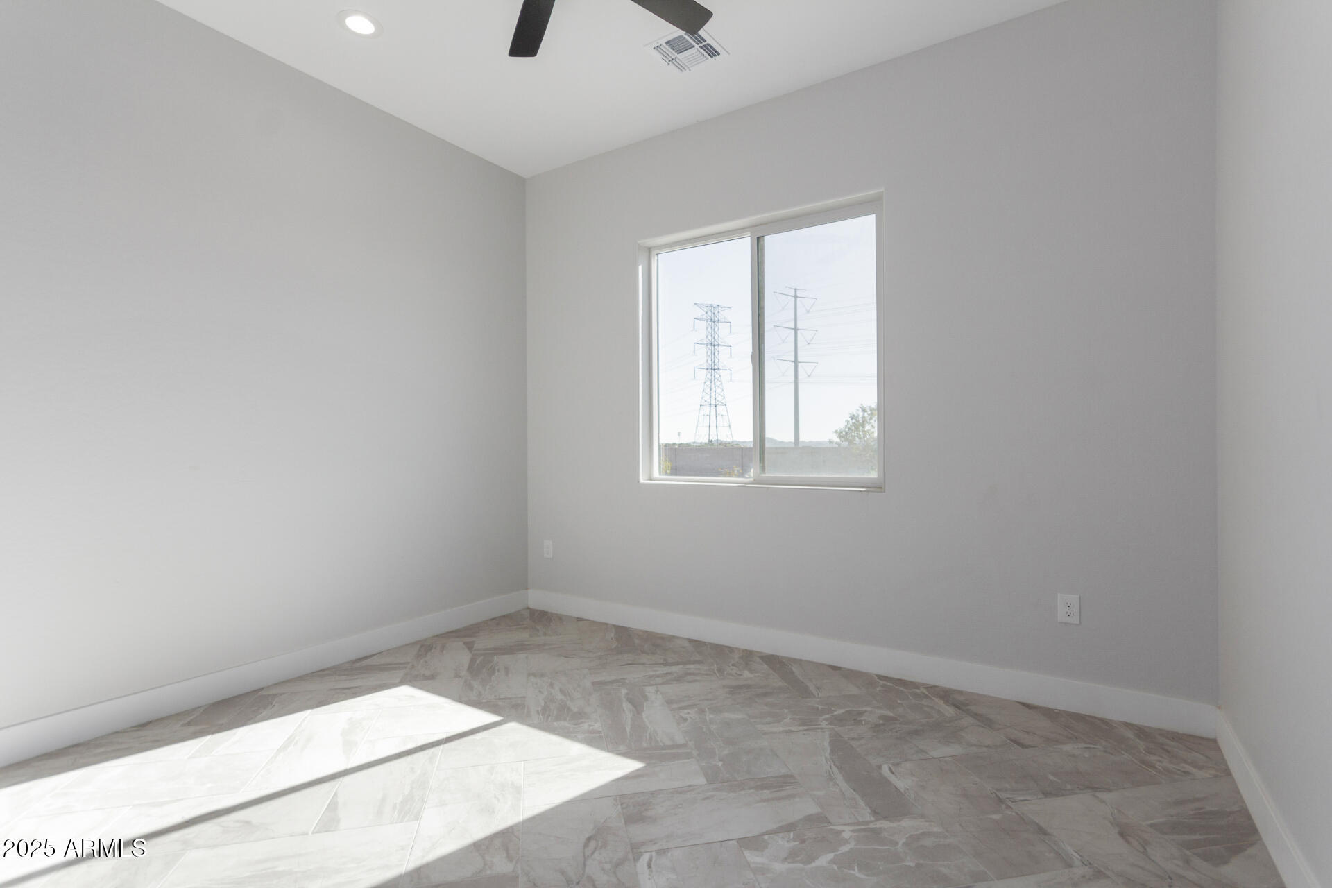 19657 West Dunlap Road Buckeye, AZ 85326 - Photo 33 of 45 an empty room with windows