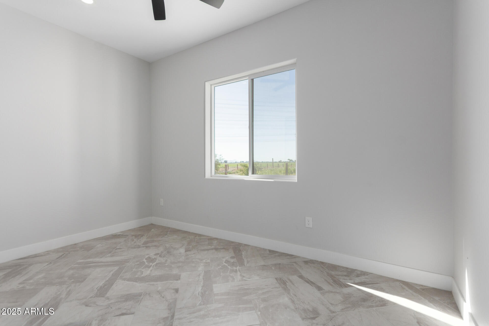 19657 West Dunlap Road Buckeye, AZ 85326 - Photo 35 of 45 an empty room with a window