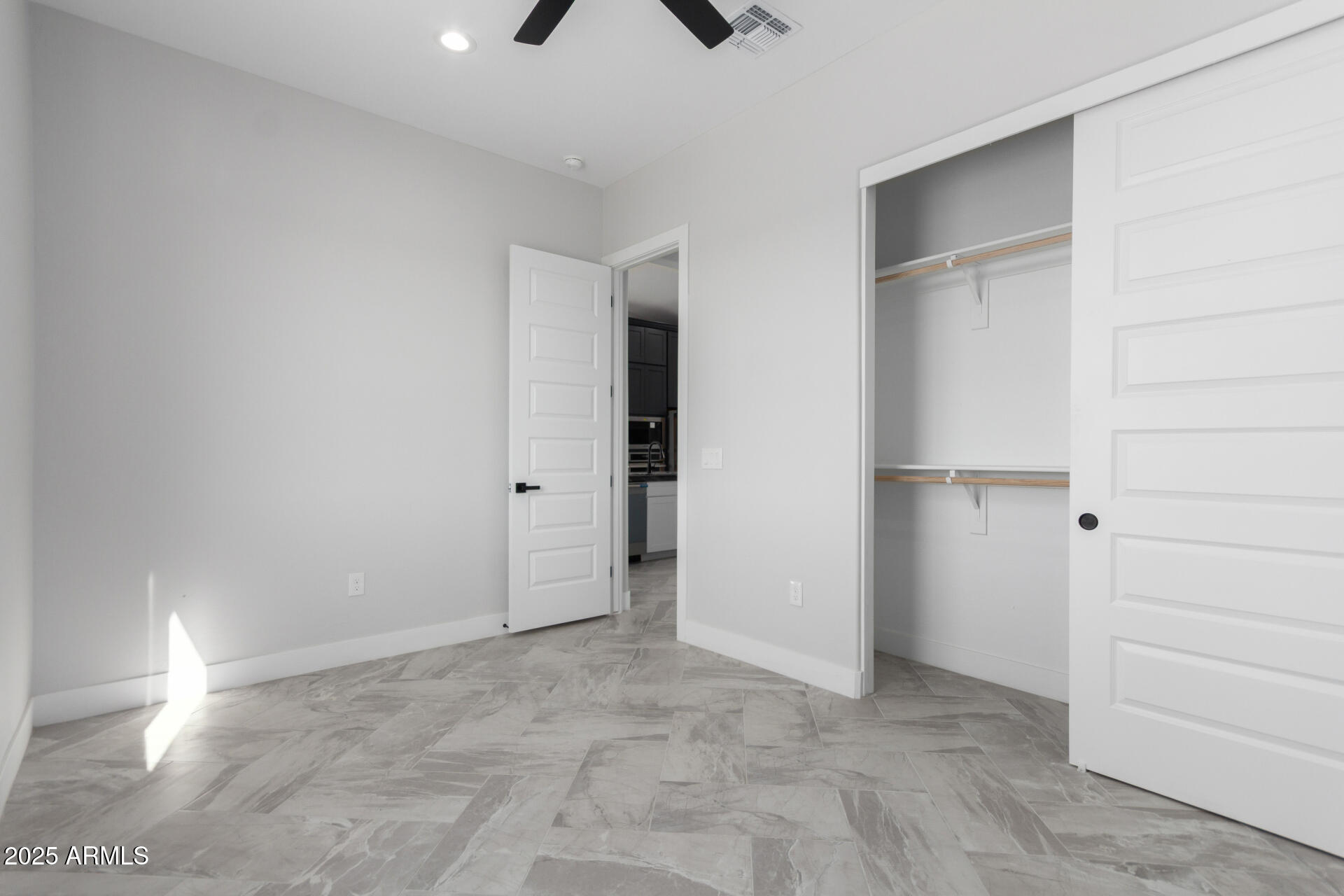 19657 West Dunlap Road Buckeye, AZ 85326 - Photo 36 of 45 an empty room with closet and windows