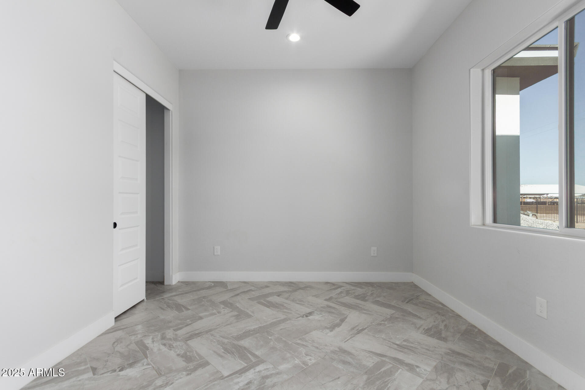 19657 West Dunlap Road Buckeye, AZ 85326 - Photo 38 of 45 an empty room with a natural light and window