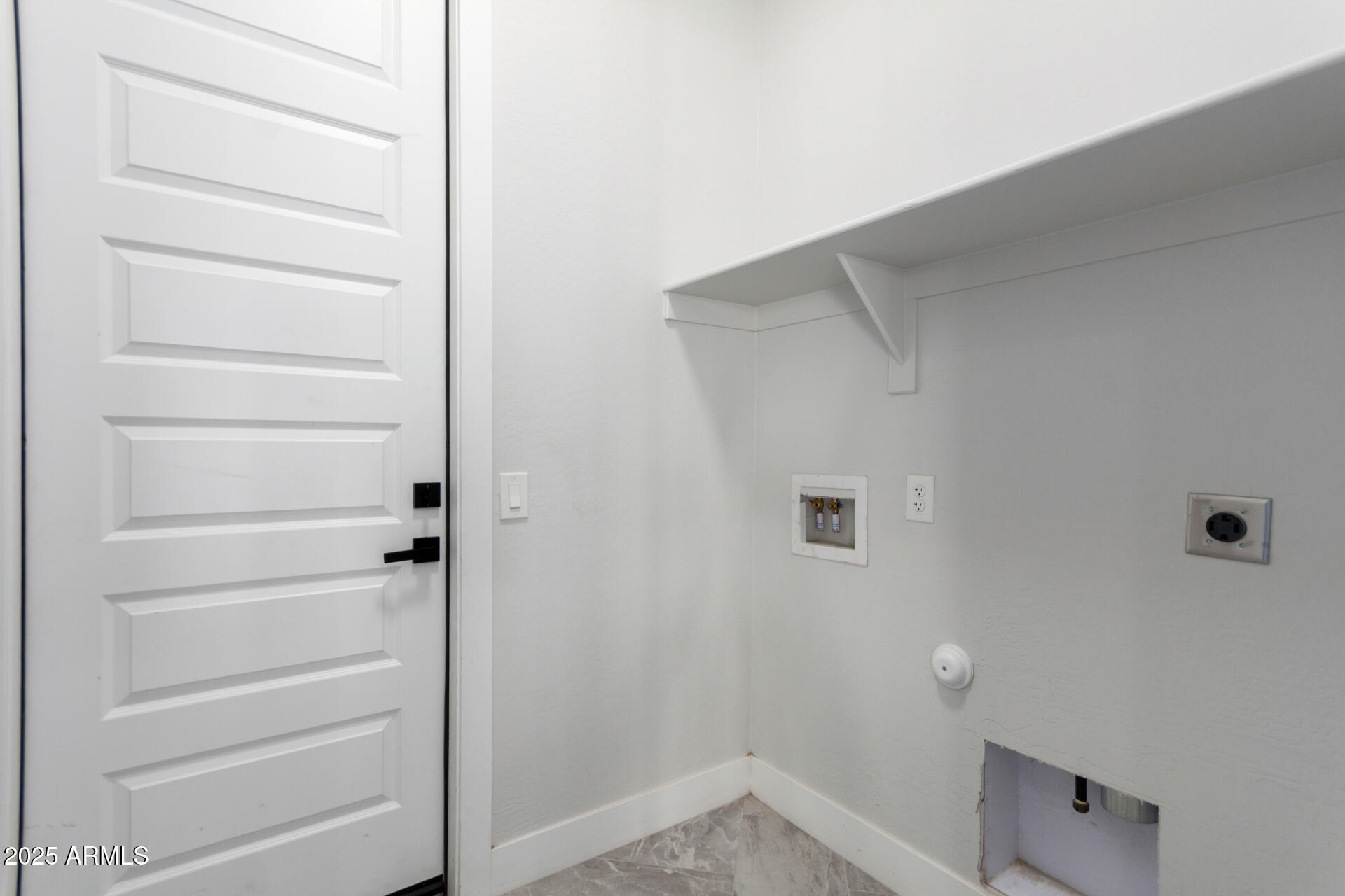 19657 West Dunlap Road Buckeye, AZ 85326 - Photo 40 of 45 a view of walk in closet with empty racks