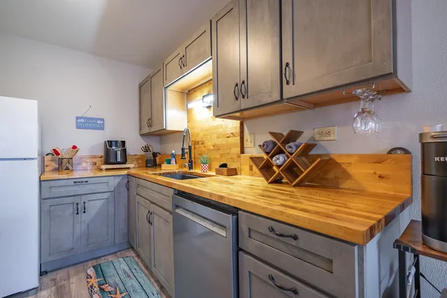 a kitchen with a sink and cabinets