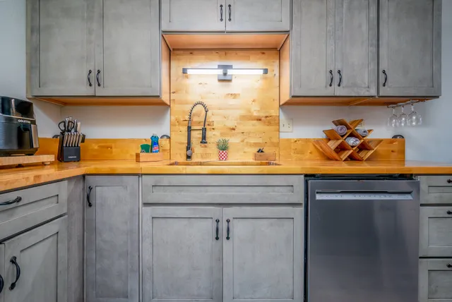 a kitchen with a sink and cabinets