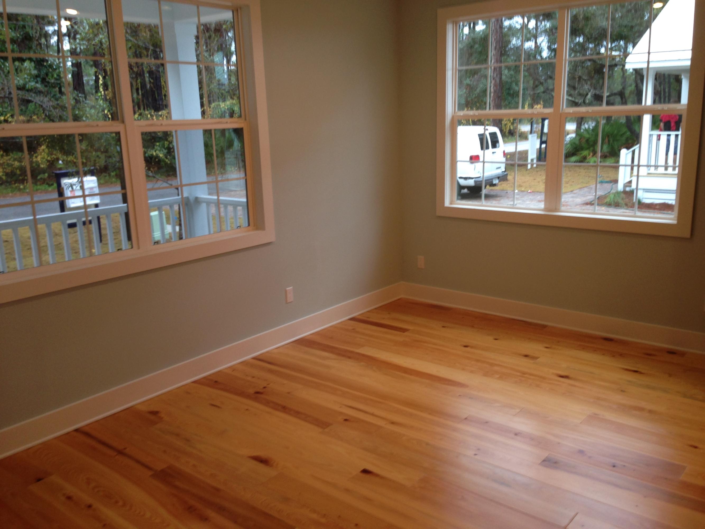 55 Sunrise Circle Santa Rosa Beach, FL 32459 - Photo 6 of 8 a view of empty room with wooden floor and fan