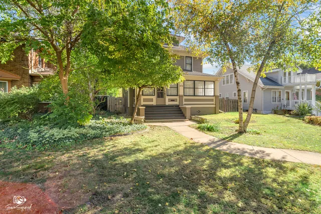 a view of a room with wooden floor and windows