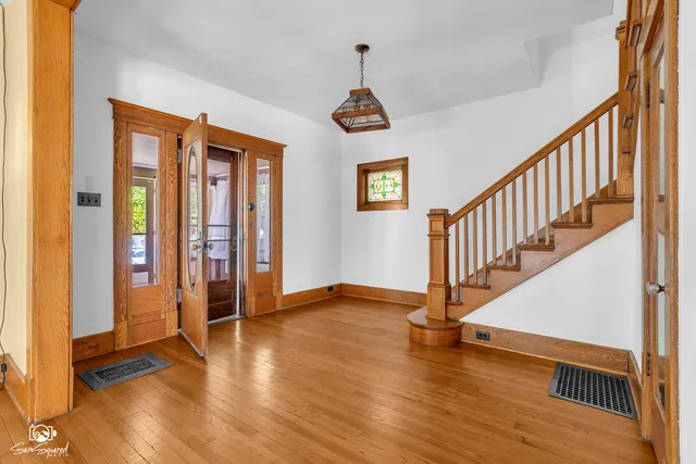 a kitchen with stainless steel appliances granite countertop a sink refrigerator and cabinets
