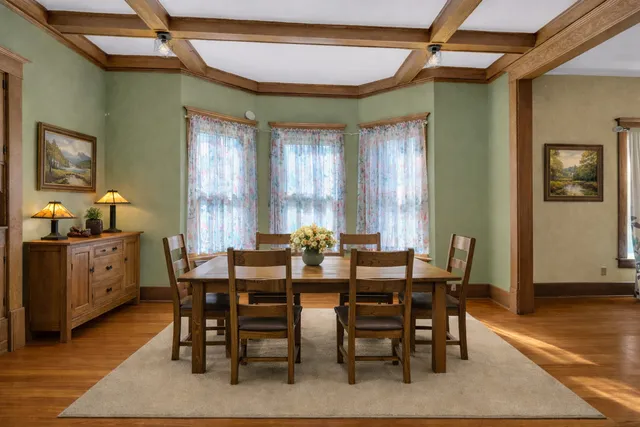 a spacious bedroom with a bed and a dresser