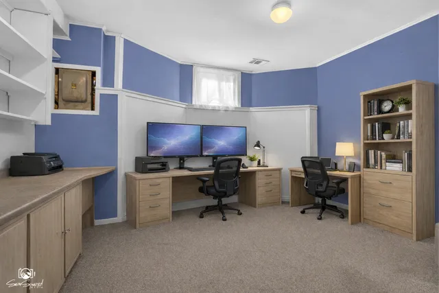 a view of a chairs and table in the balcony