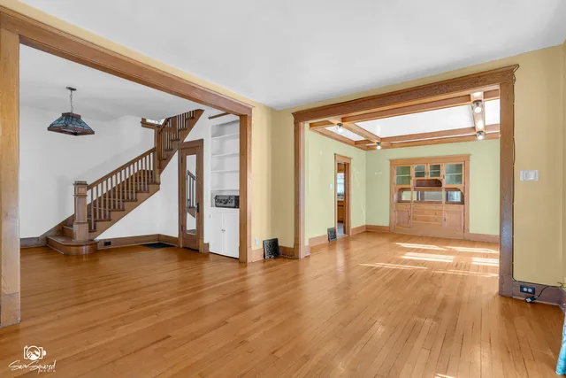 a view of an entryway with wooden floor
