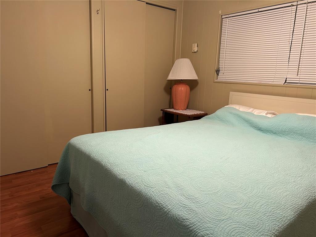 4775 Tri Par Drive Sarasota, FL 34234 - Photo 16 of 50 a bed sitting in a bedroom next to a window