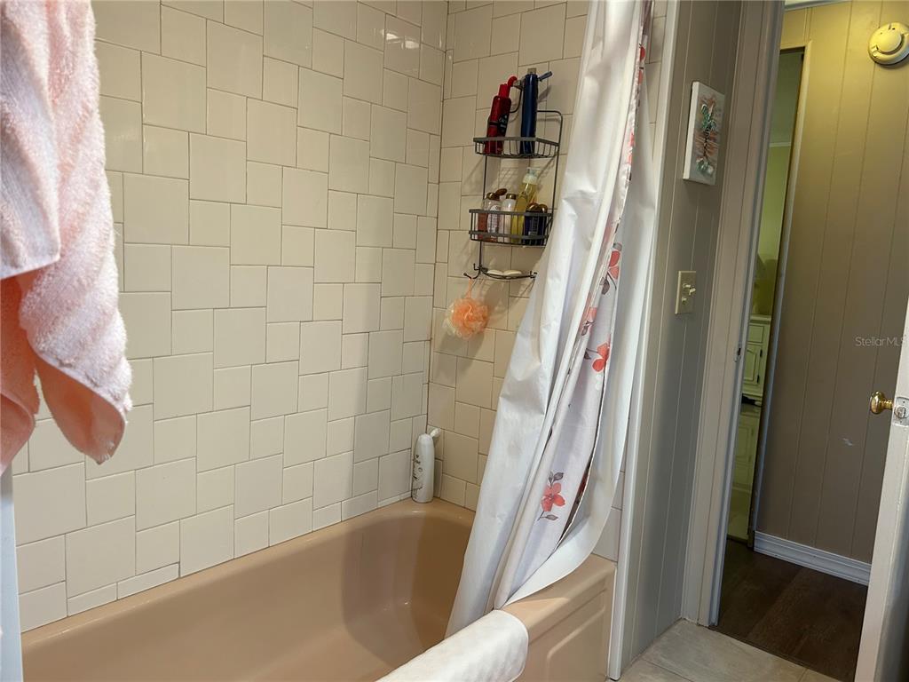 4775 Tri Par Drive Sarasota, FL 34234 - Photo 18 of 50 a bathroom with a bathtub and a shower