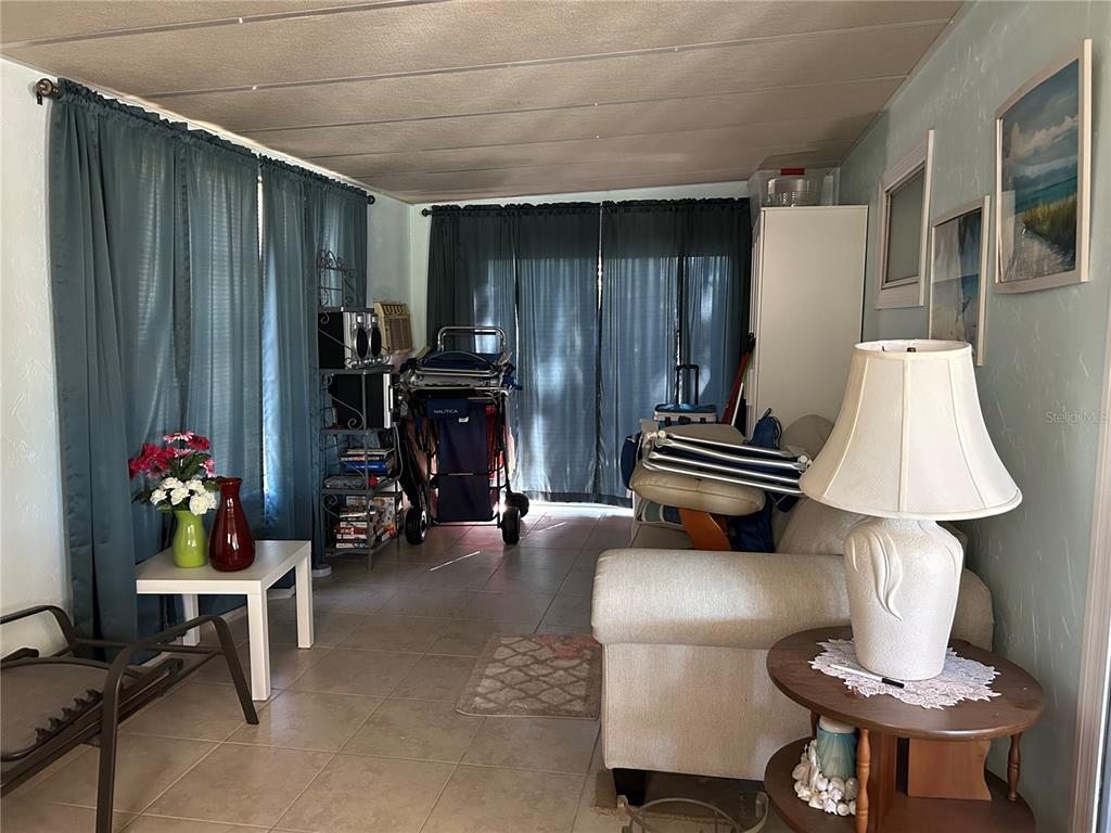 4775 Tri Par Drive Sarasota, FL 34234 - Photo 20 of 50 a living room with furniture and a fireplace