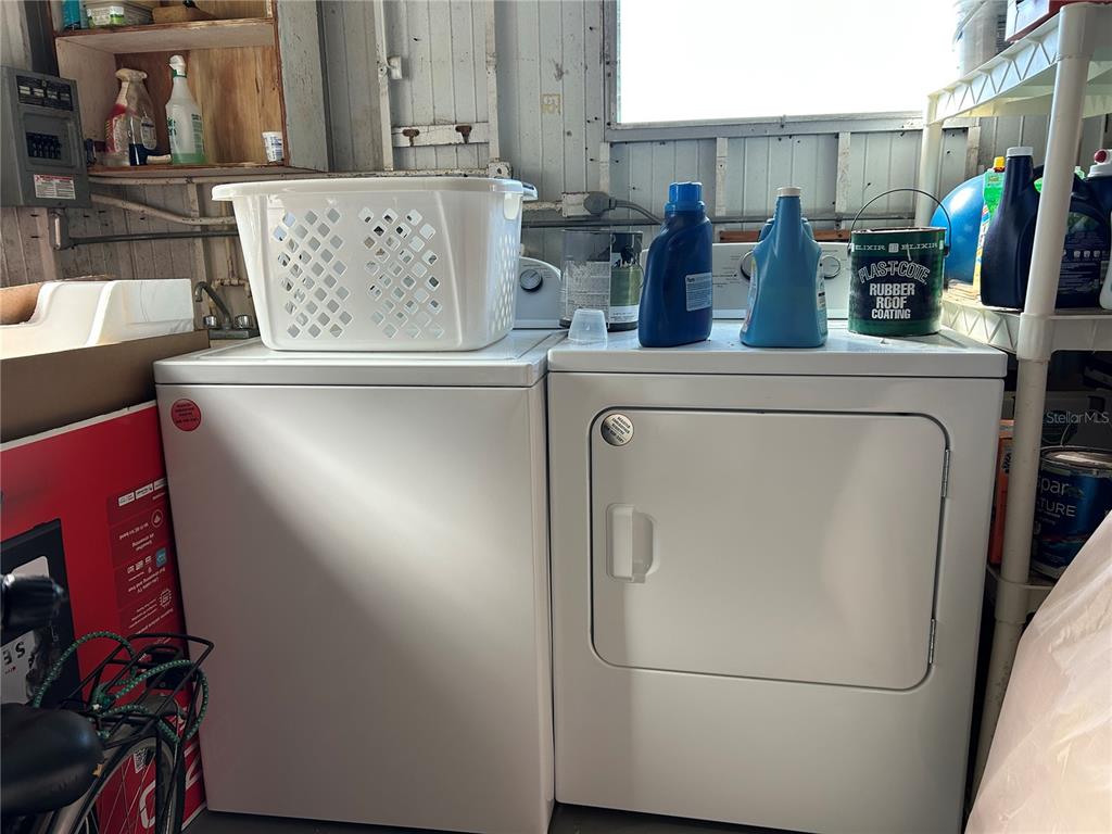 4775 Tri Par Drive Sarasota, FL 34234 - Photo 21 of 50 a view of storage and utility room with racks on the wall