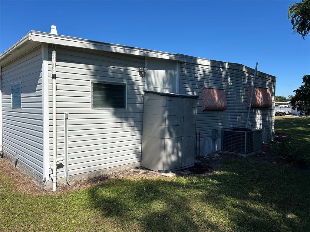4775 Tri Par Drive Sarasota, FL 34234 - Photo 31 of 50 a view of a house with a yard