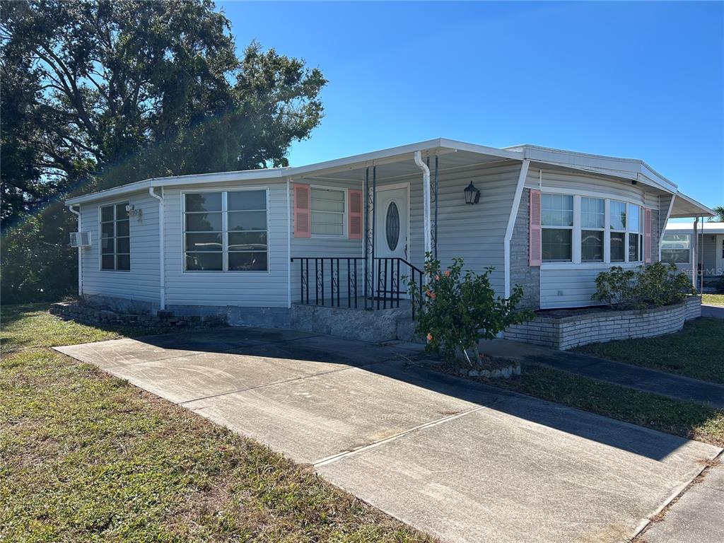 4775 Tri Par Drive Sarasota, FL 34234 - Photo 33 of 50 a house view with a garden space