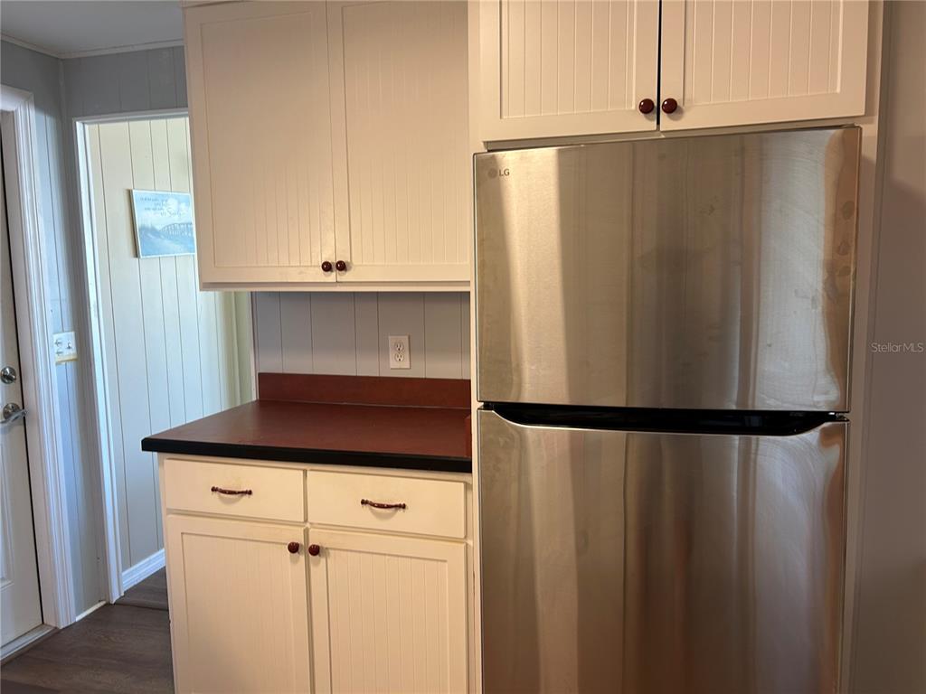 4775 Tri Par Drive Sarasota, FL 34234 - Photo 6 of 50 a white refrigerator freezer sitting inside of a kitchen
