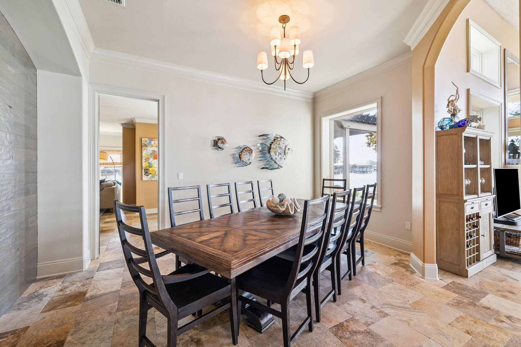 221 Bay Cir Drive Santa Rosa Beach, FL 32459 - Photo 15 of 98 a view of a dining room with furniture and chandelier