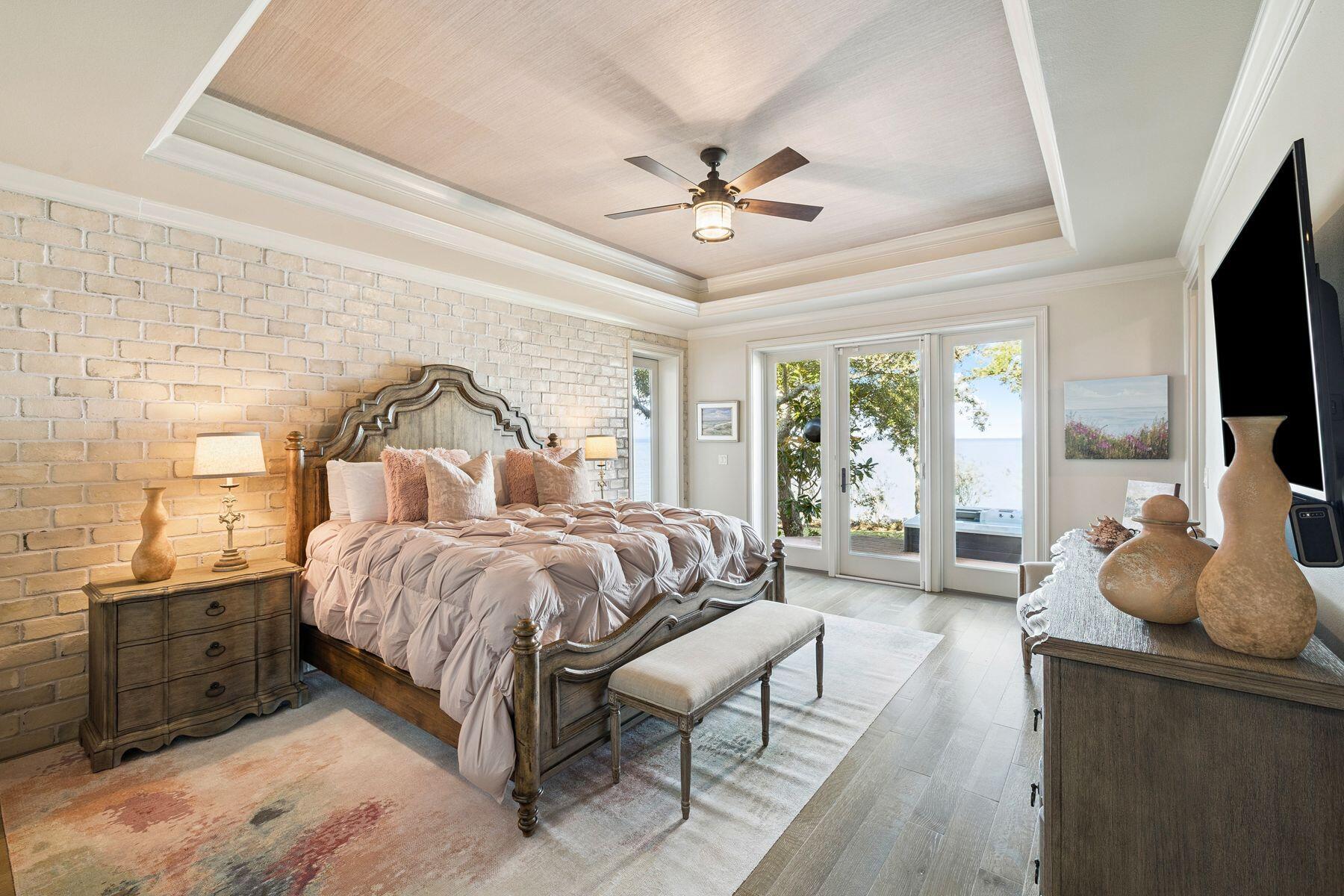 221 Bay Cir Drive Santa Rosa Beach, FL 32459 - Photo 30 of 98 a spacious bedroom with a bed and glass windows