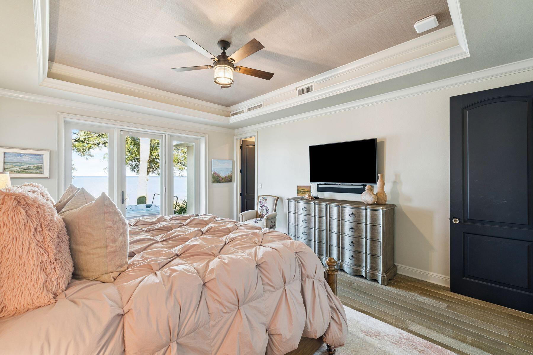 221 Bay Cir Drive Santa Rosa Beach, FL 32459 - Photo 31 of 98 a bedroom with a bed and a flat screen tv