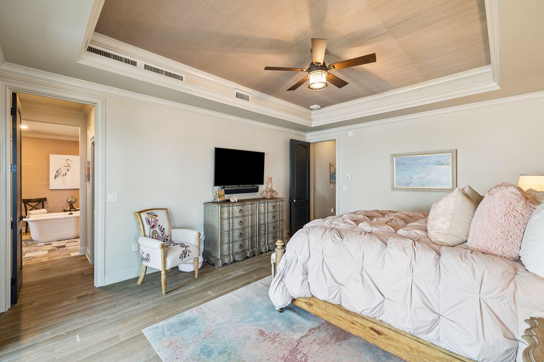 221 Bay Cir Drive Santa Rosa Beach, FL 32459 - Photo 32 of 98 a bedroom with a bed and a flat screen tv