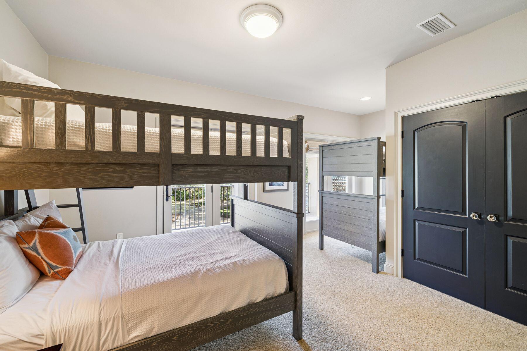 221 Bay Cir Drive Santa Rosa Beach, FL 32459 - Photo 43 of 98 a bedroom with a bed and wooden floor