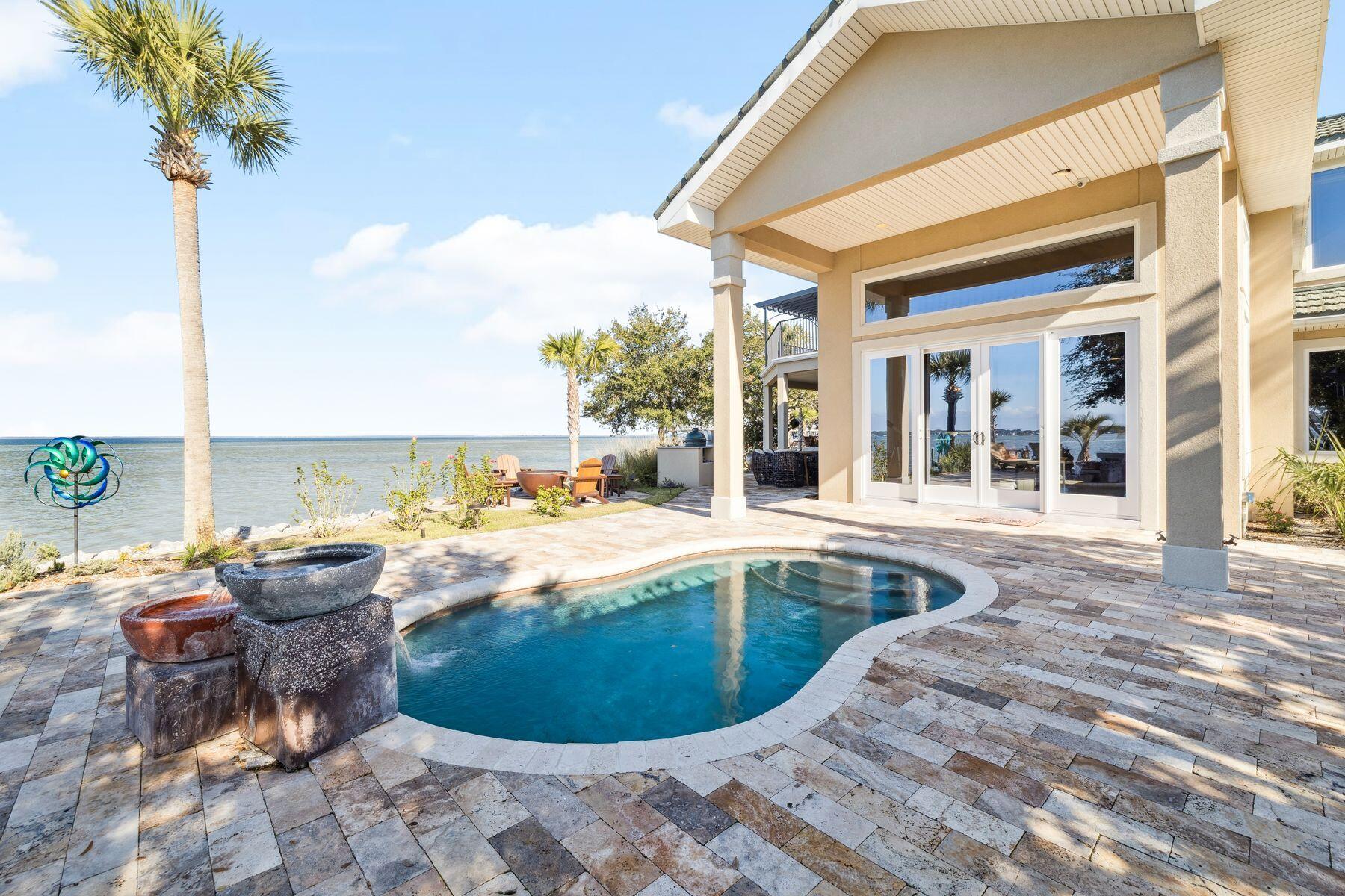 221 Bay Cir Drive Santa Rosa Beach, FL 32459 - Photo 55 of 98 a view of a swimming pool with an outdoor seating