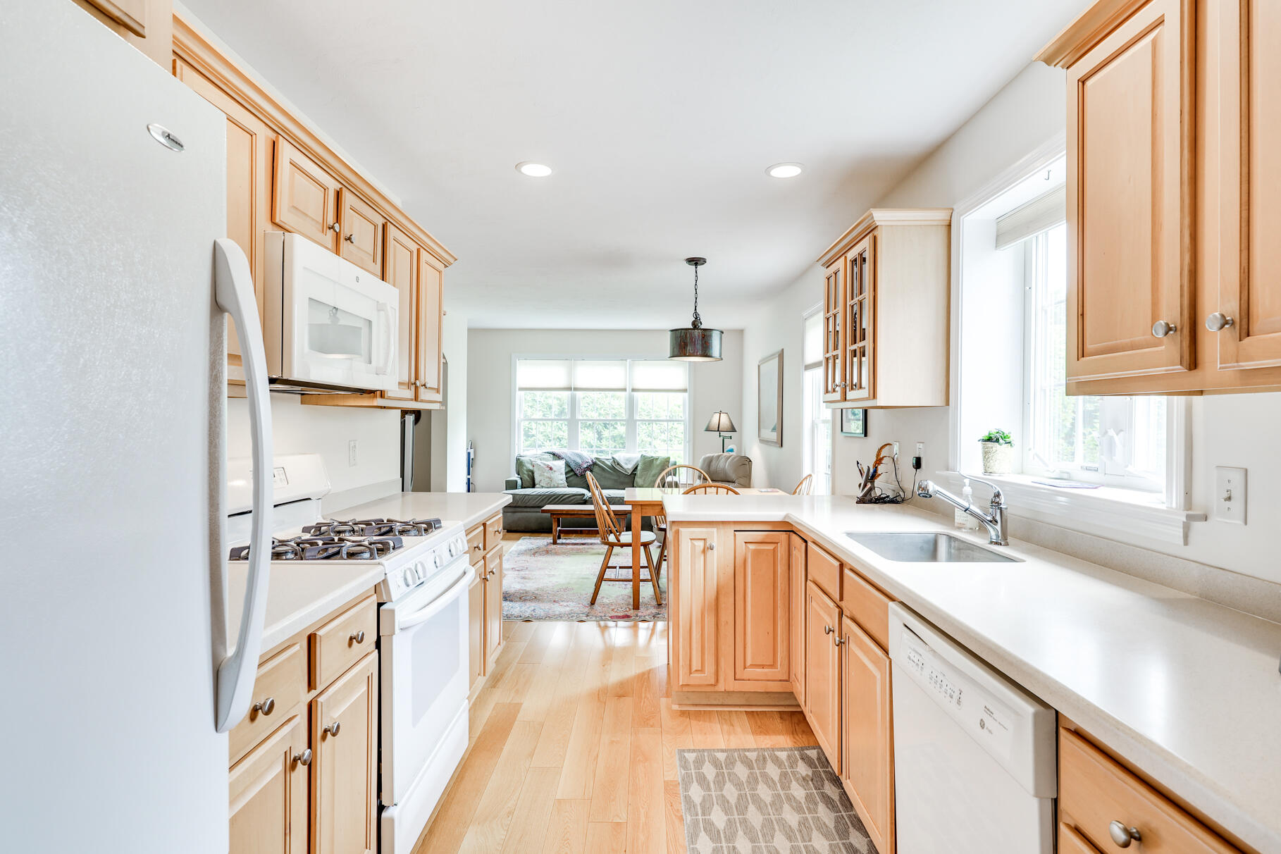 9 Stratford Ridge Mashpee, MA 02649 - Photo 10 of 34 a kitchen with stainless steel appliances kitchen island granite countertop a sink stove refrigerator and cabinets