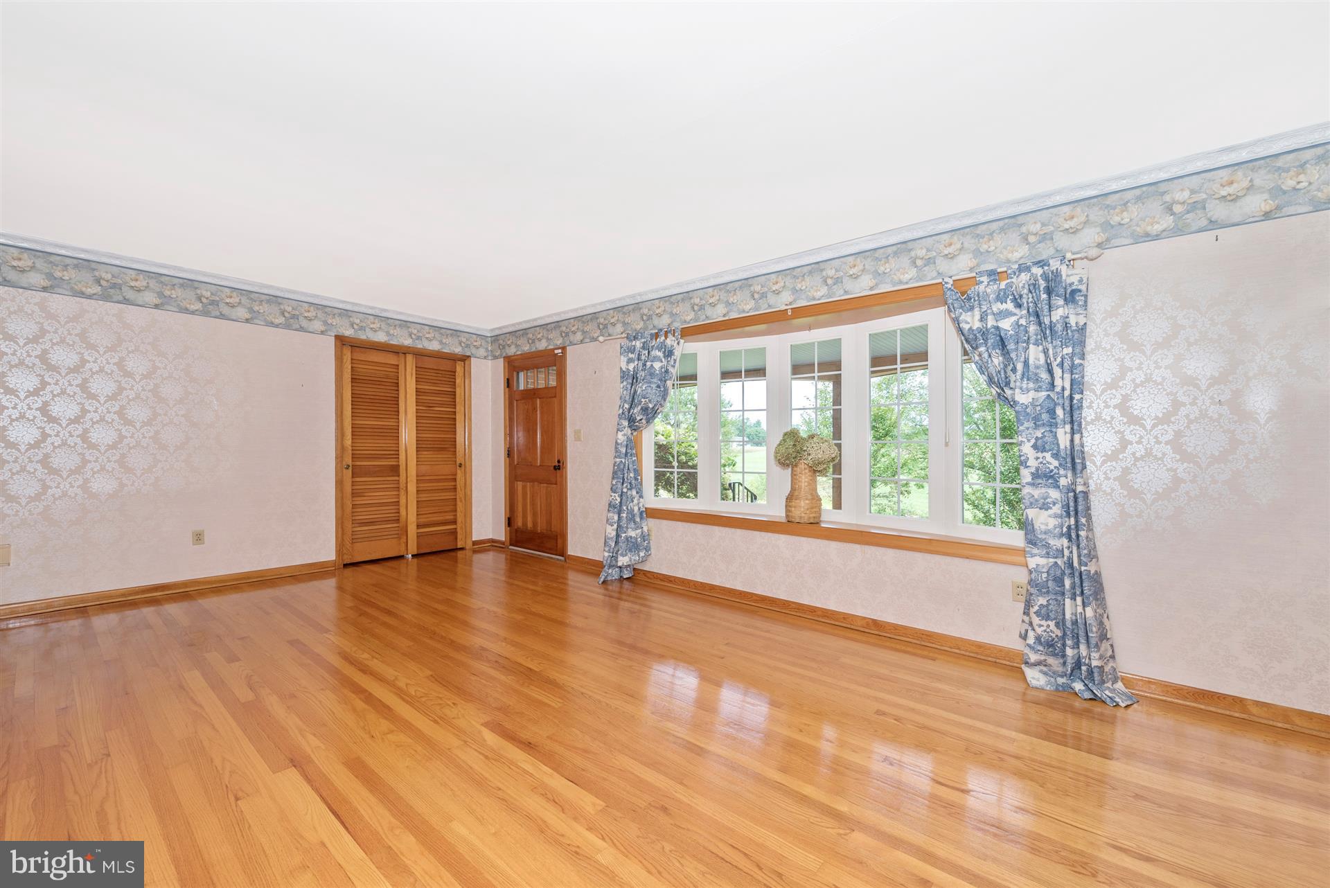12539 Molasses Road Union Bridge, MD 21791 - Photo 14 of 30 a view of an empty room with a window and wooden floor