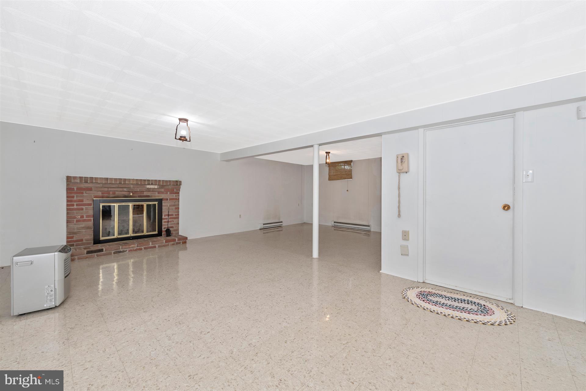12539 Molasses Road Union Bridge, MD 21791 - Photo 30 of 30 a view of a livingroom with wooden floor and a fireplace