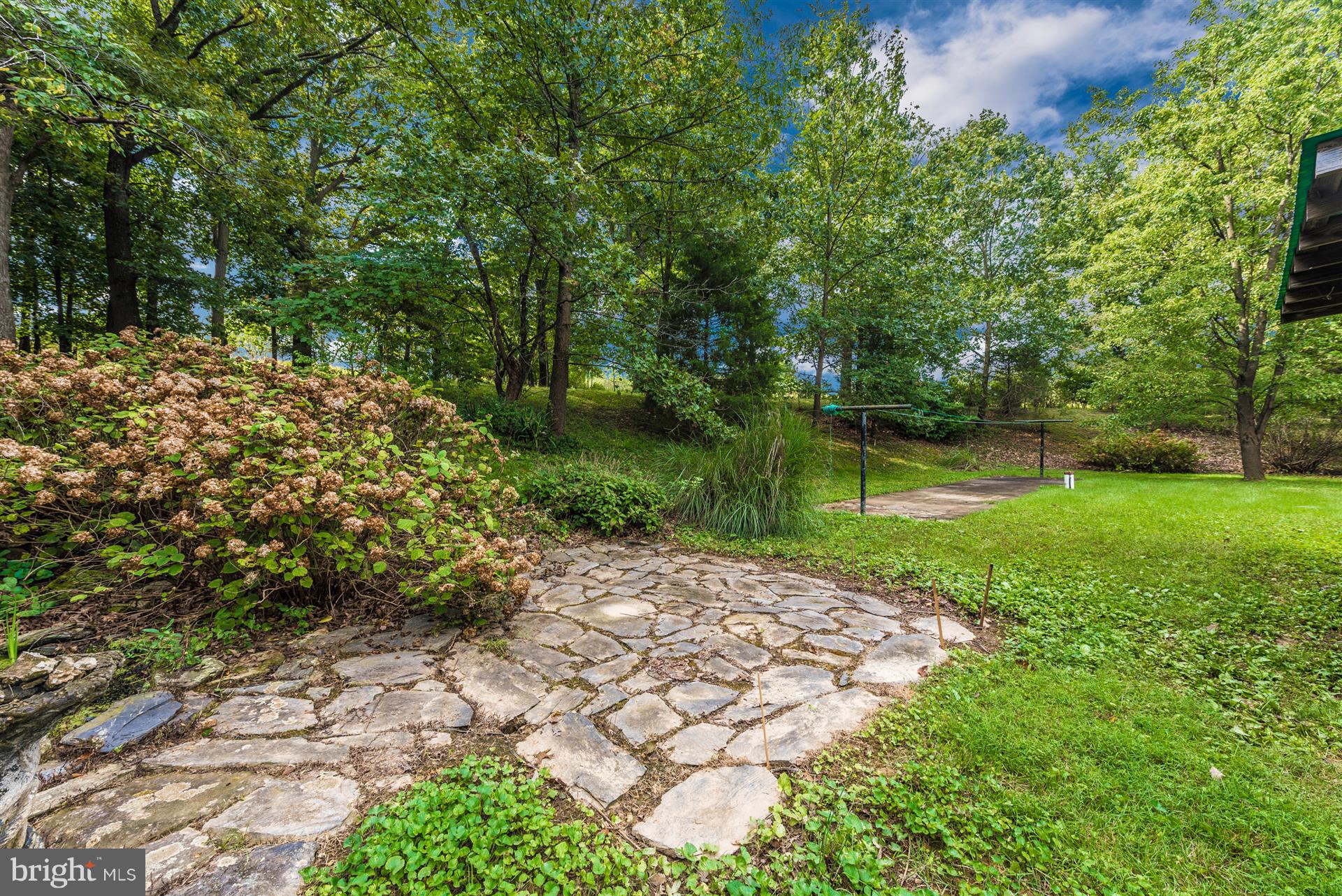 12539 Molasses Road Union Bridge, MD 21791 - Photo 8 of 30 a view of a garden with a bench