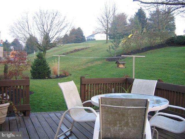 664 West Church Road Ephrata, PA 17522 - Photo 4 of 18 a view of a patio with a table chairs and a backyard