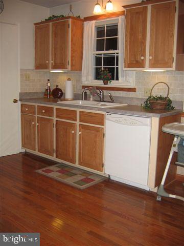 664 West Church Road Ephrata, PA 17522 - Photo 8 of 18 a kitchen with granite countertop a sink cabinets and wooden floor