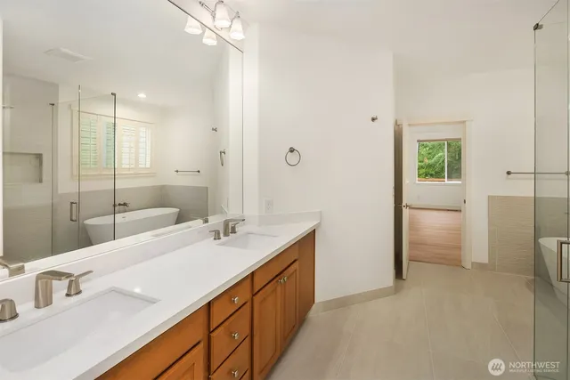 a bathroom with a double vanity sink a and mirror
