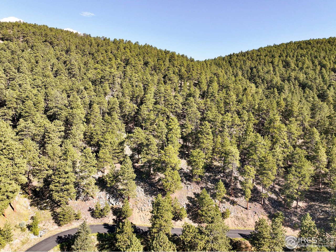 695 Cutter Lane Boulder, CO 80302 - Photo 22 of 39 a view of a large building with mountains in the background