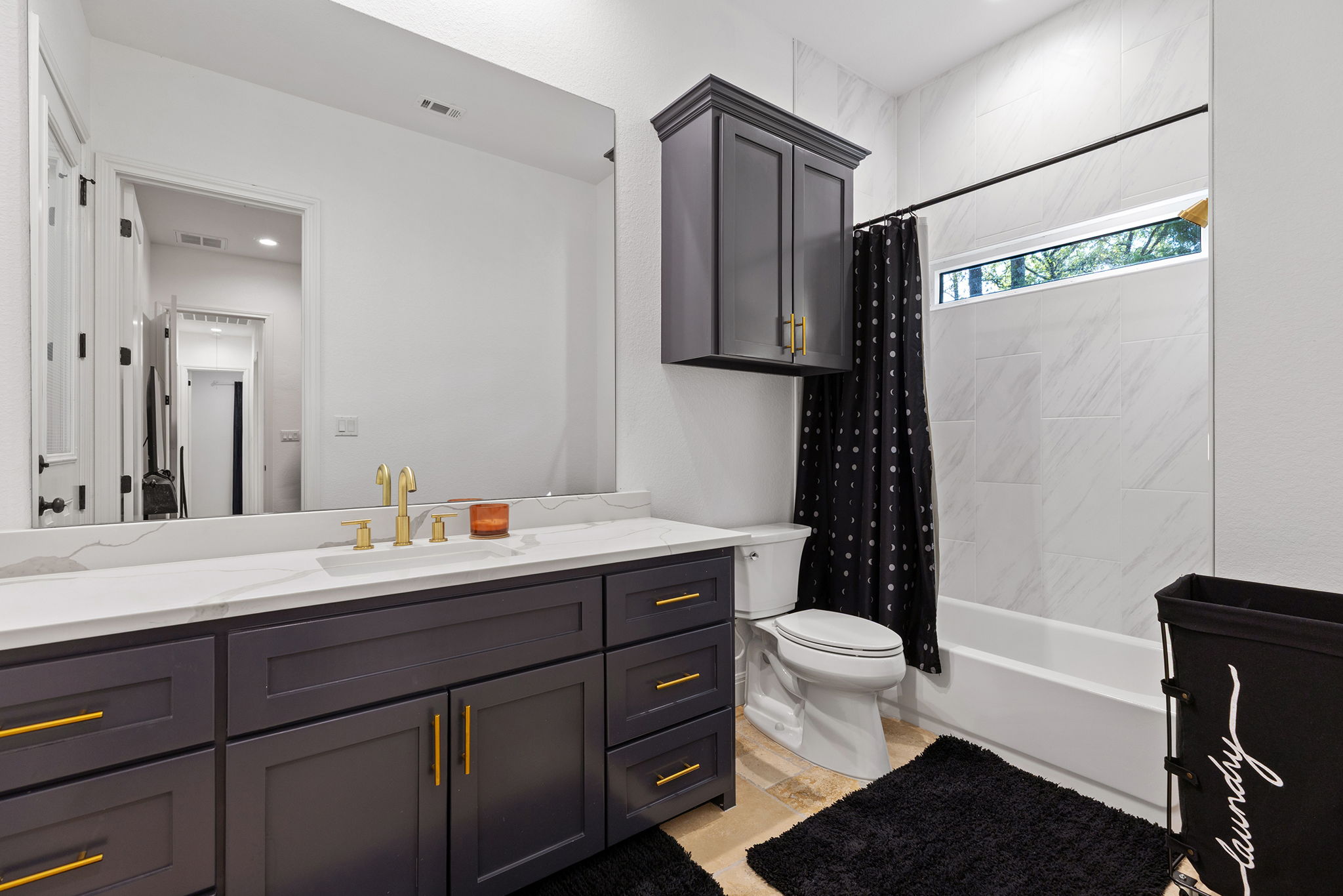 153 Fawn Hollow Elgin, TX 78621 - Photo 28 of 40 a bathroom with a sink a toilet a mirror and shower