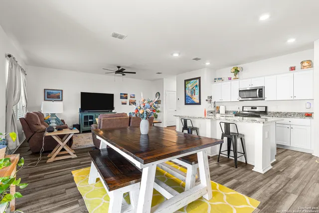 a view of kitchen and dining area with furniture