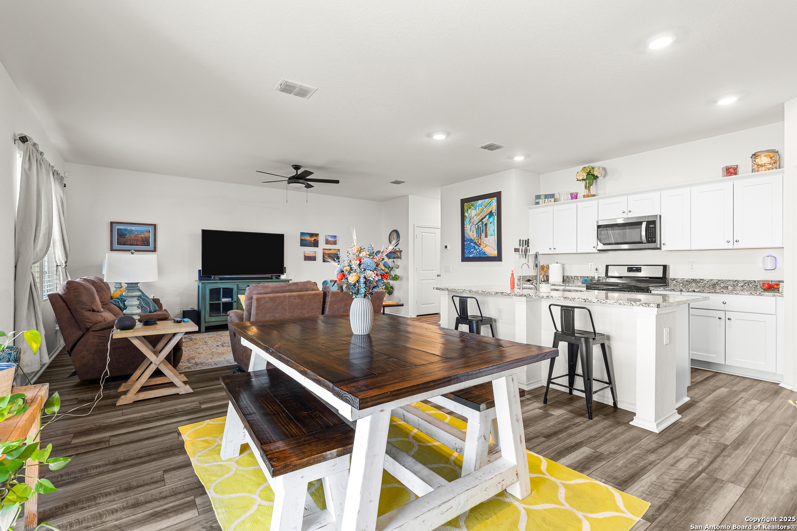 a view of kitchen and dining area with furniture