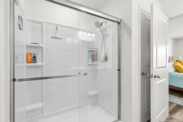 a bathroom with a shower and a toilet
