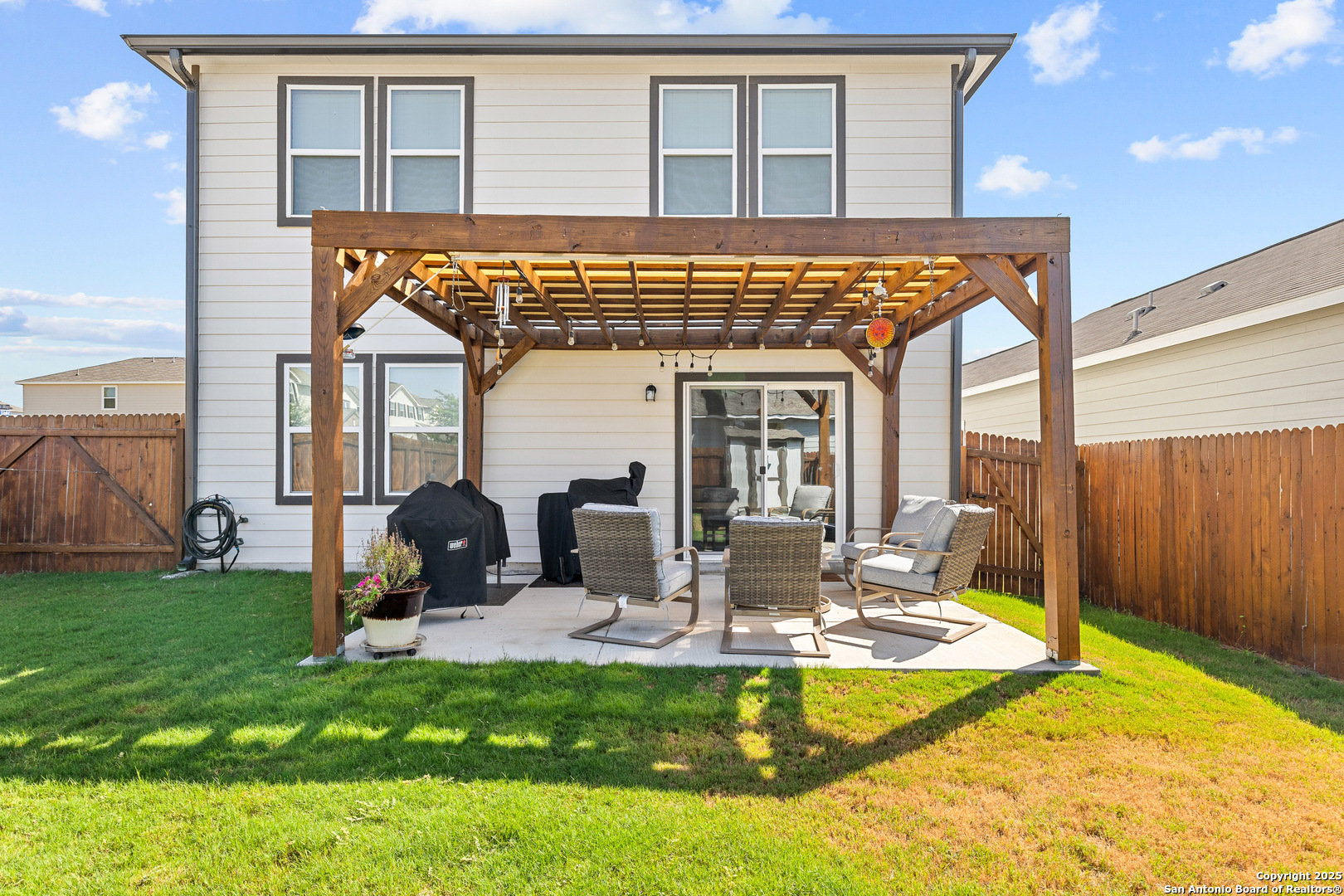 5259 Winding Streme St. Hedwig, TX 78152 - Photo 22 of 24 a view of a house with backyard porch and sitting area