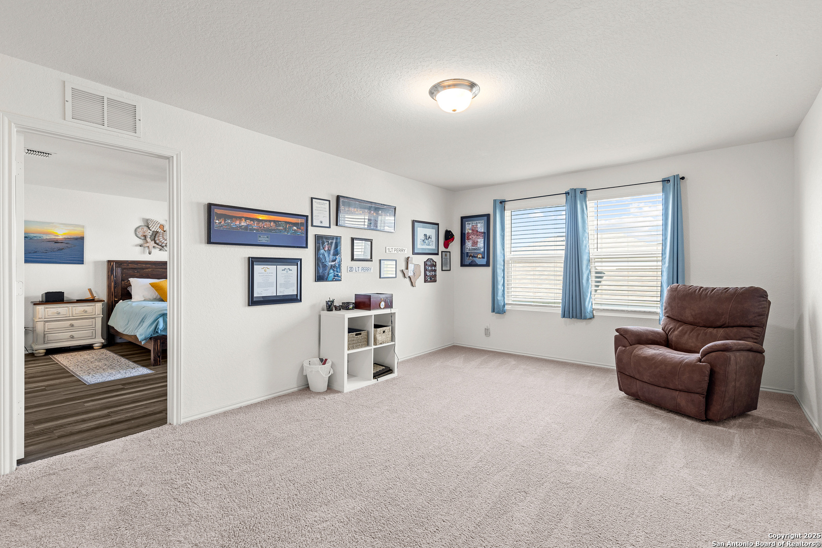 5259 Winding Streme St. Hedwig, TX 78152 - Photo 7 of 24 a view of a livingroom with workspace and a window