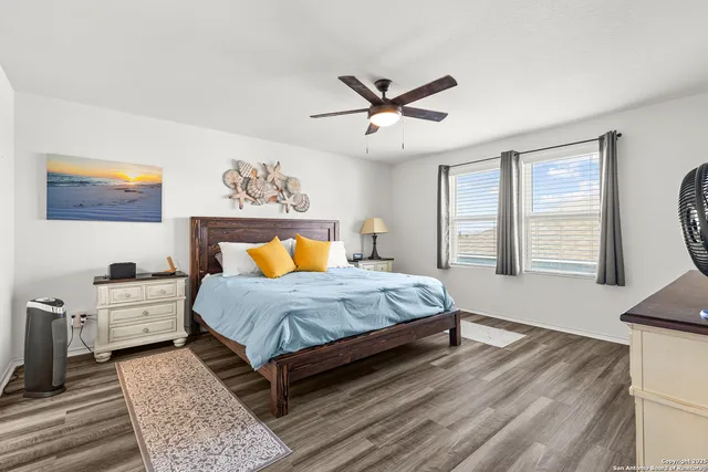 a spacious bedroom with a large bed and a window