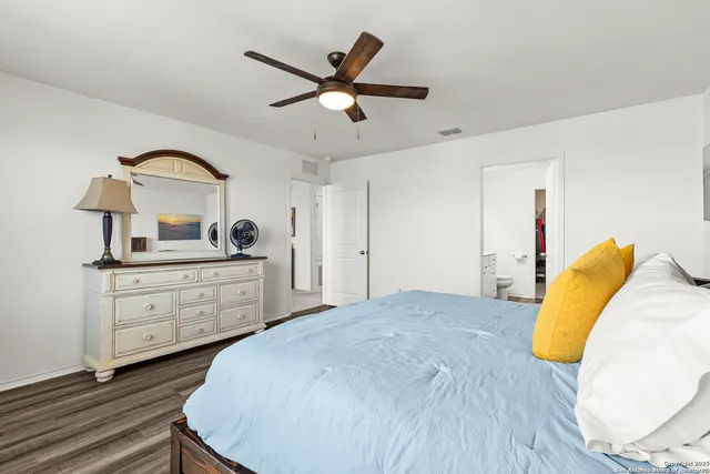 a bedroom with a bed and a dresser