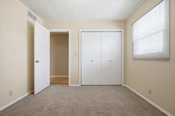 wooden floor and closet in a room