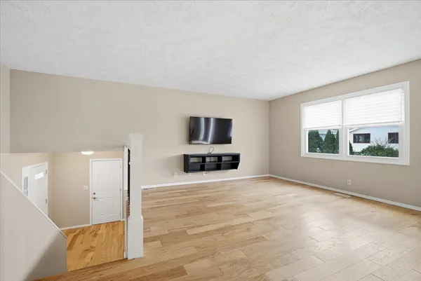 a view of dining room with furniture and floor to ceiling window