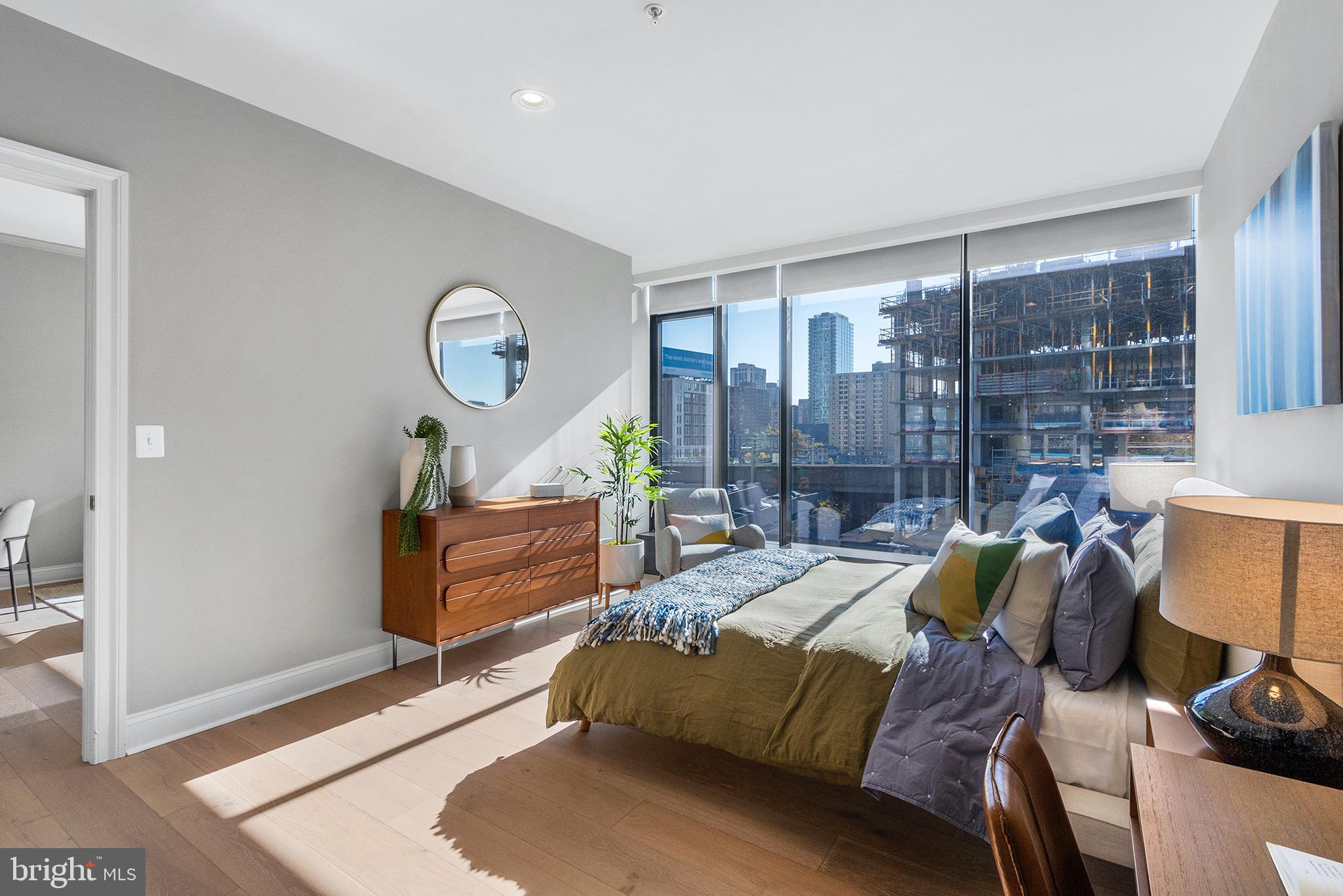 58 North 23rd Street, Unit 1309 Philadelphia, PA 19103 - Photo 11 of 30 a living room with furniture and a window
