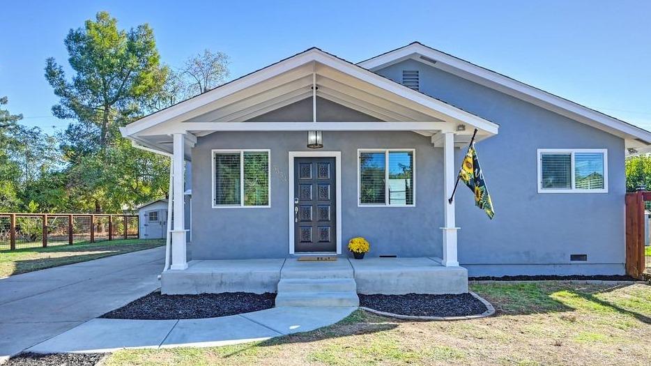 a front view of a house with garden
