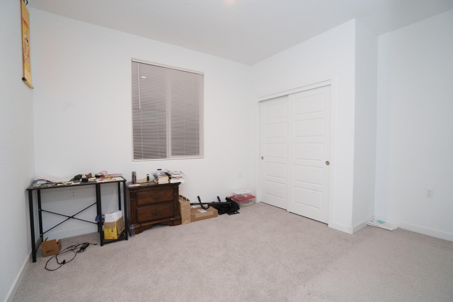 5769 West Austin Way Fresno, CA 93722 - Photo 26 of 32 a room with furniture and air hockey table