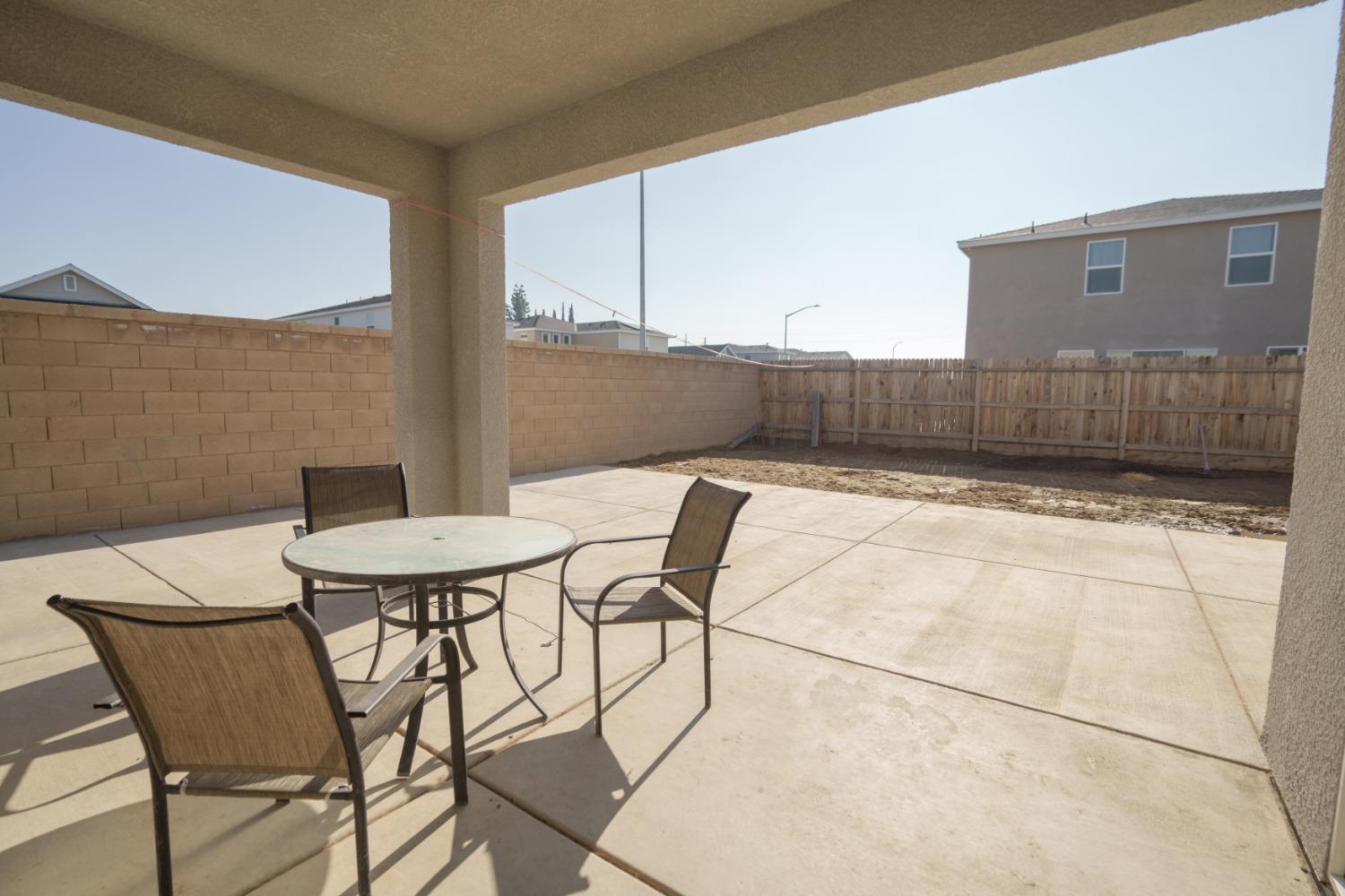 5769 West Austin Way Fresno, CA 93722 - Photo 27 of 32 a view of a outdoor seating area