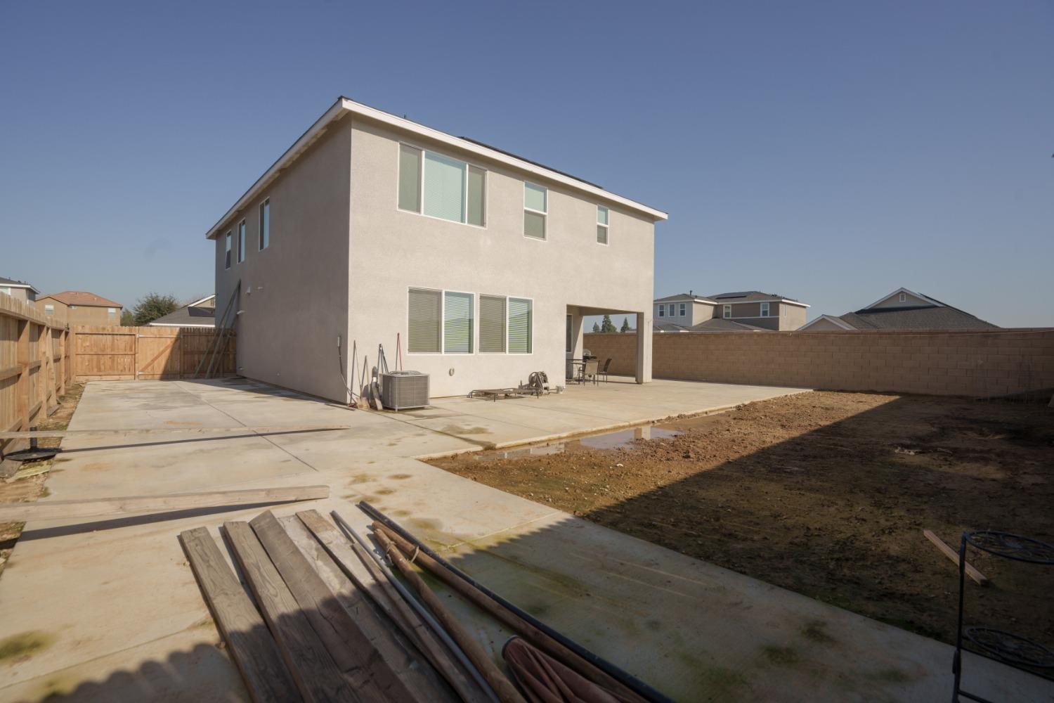5769 West Austin Way Fresno, CA 93722 - Photo 30 of 32 a view of a house with backyard