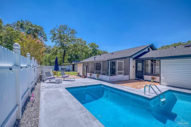 a front view of house with yard and outdoor seating